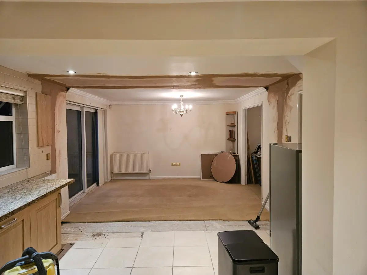 The same Lawn room plastered with the beam boxed in