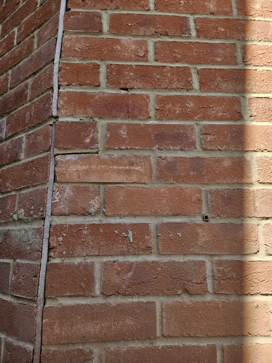 Close detail of the facing brickwork on the garden building