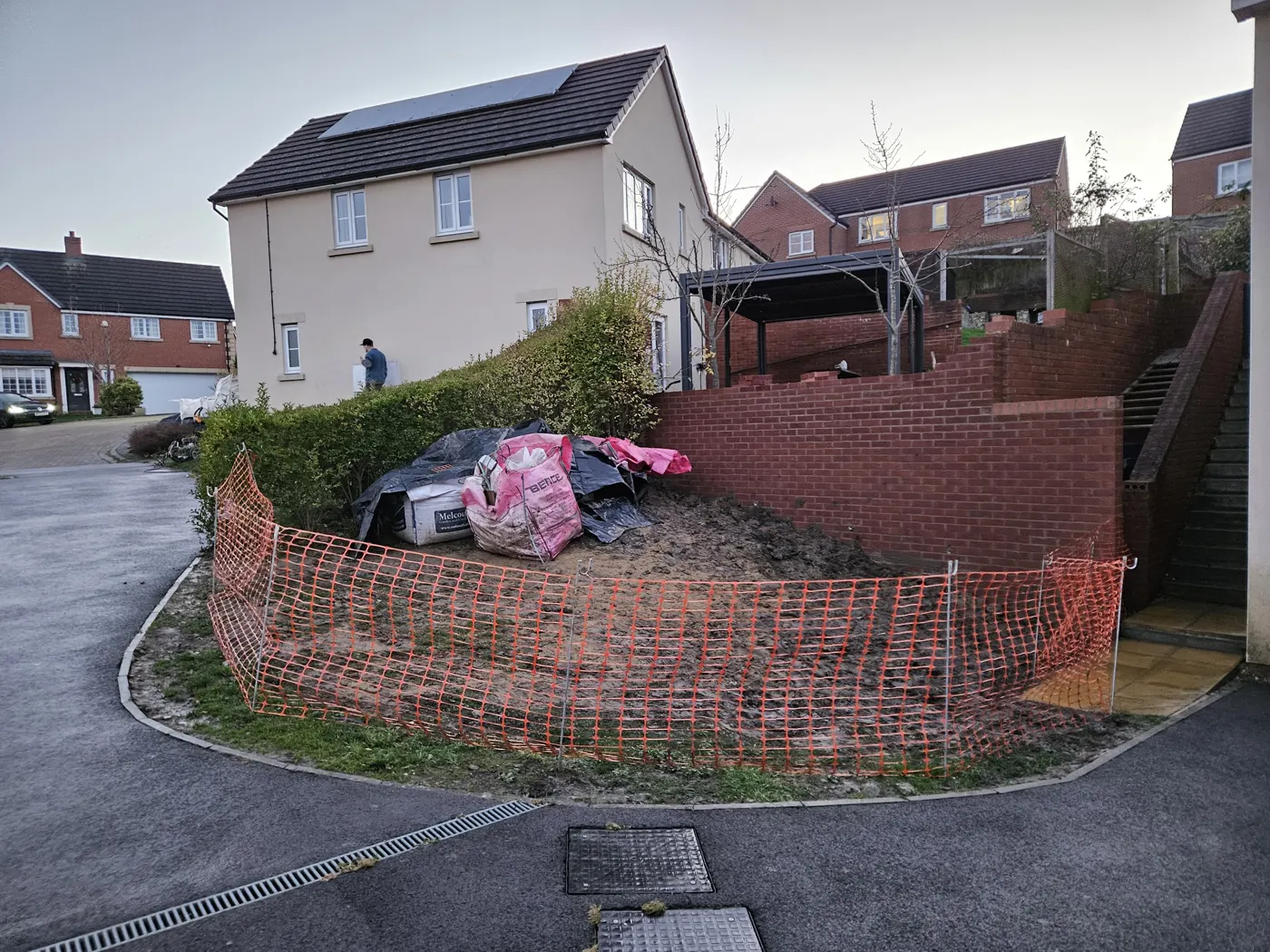 The rebuilt boundary wall at full height