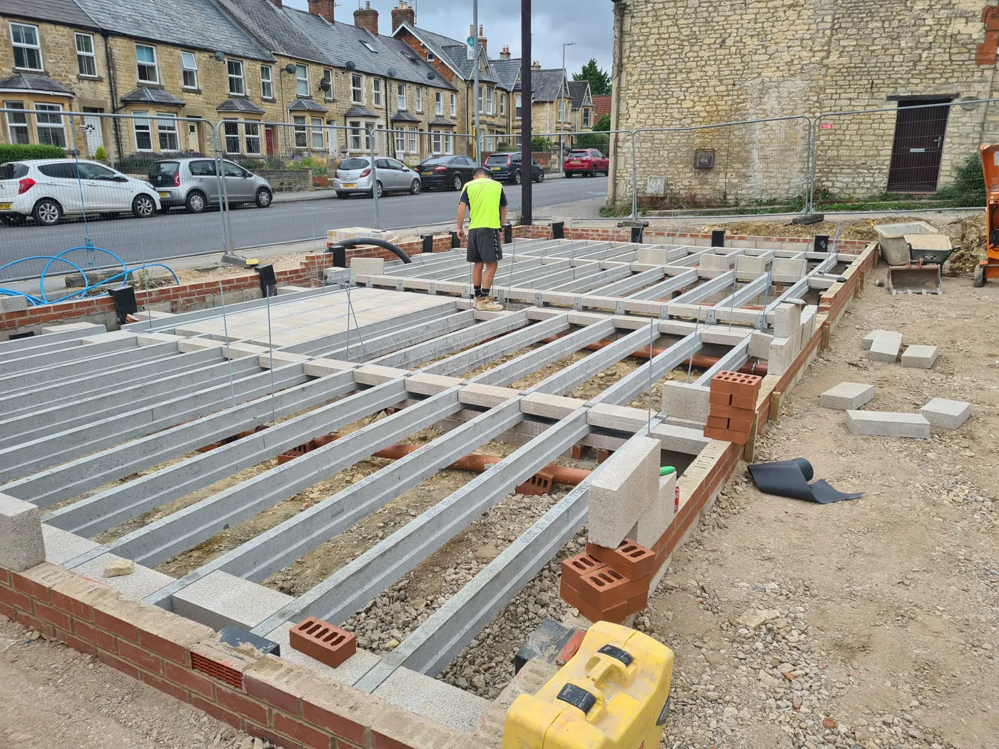 Wide view of the beam-and-block floor across both plots