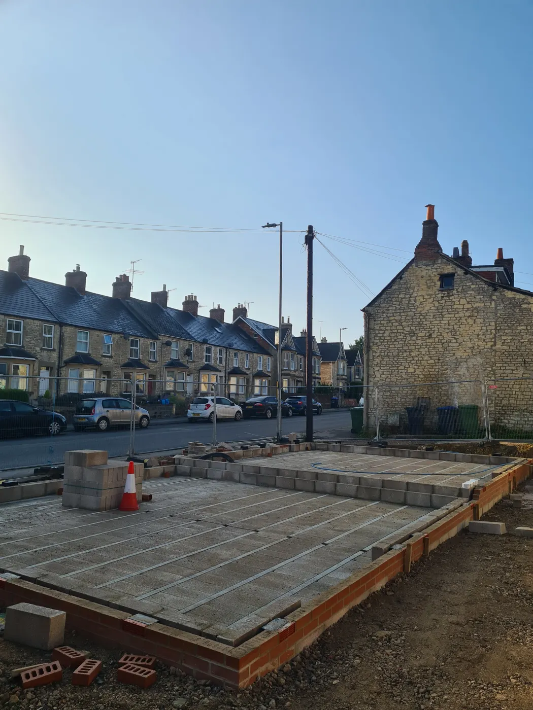 The new floor structure with the existing stone houses on London Road behind
