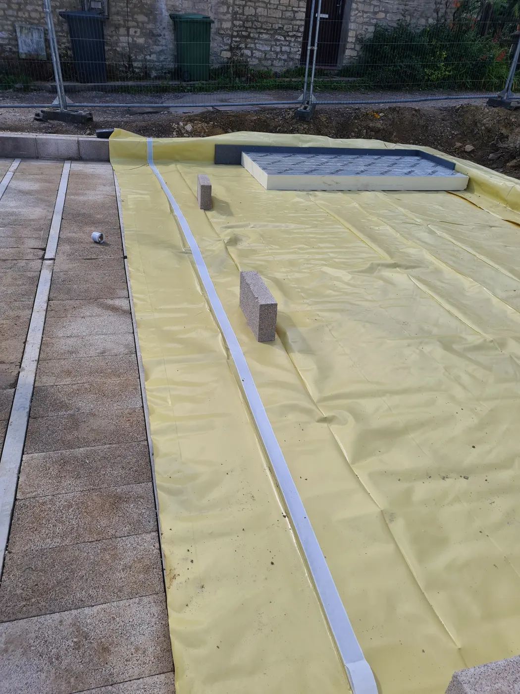 Radon barrier membrane laid over the beam-and-block floor