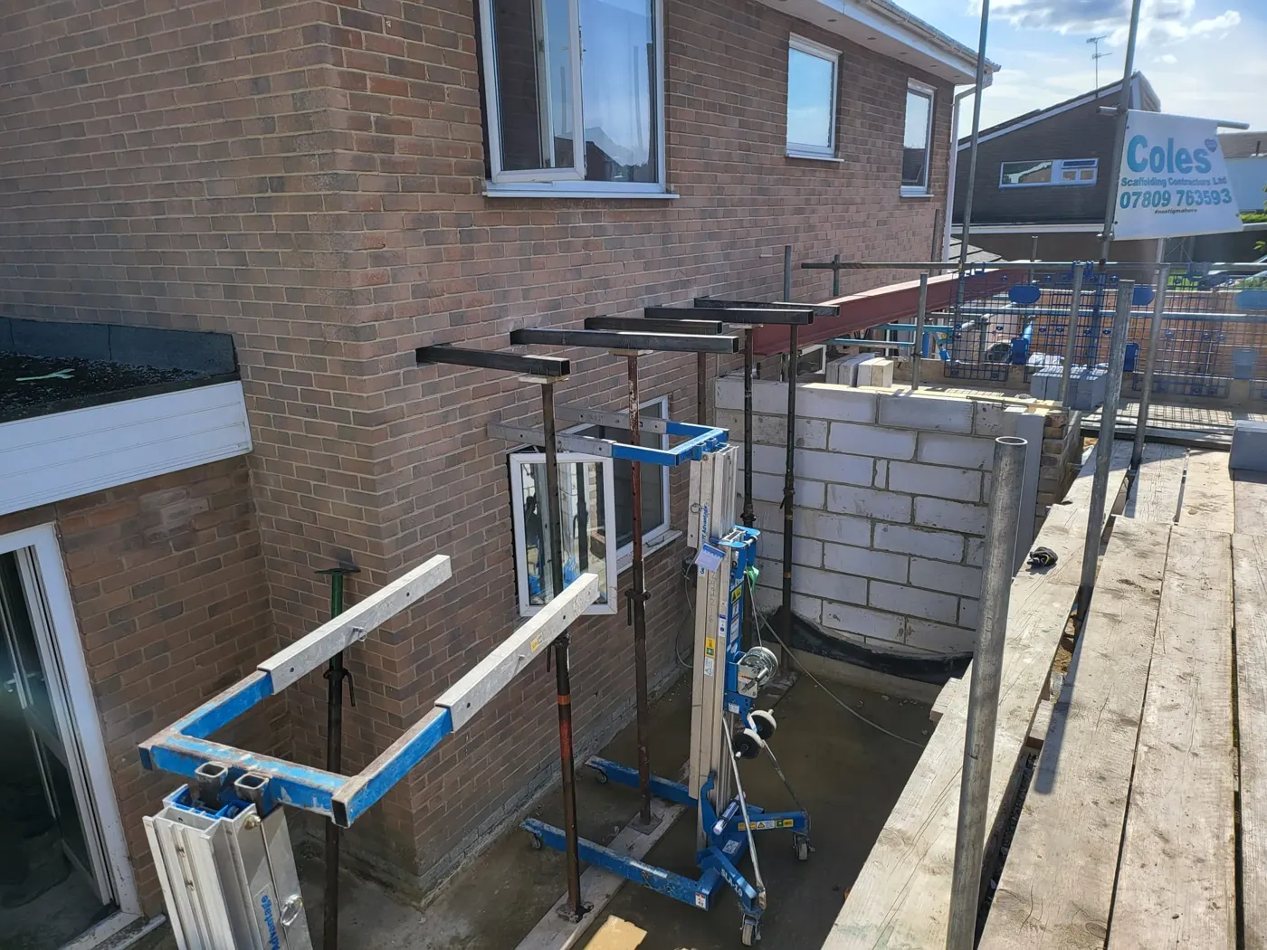 Steel beams and temporary propping across the rear of the house while the walls are removed