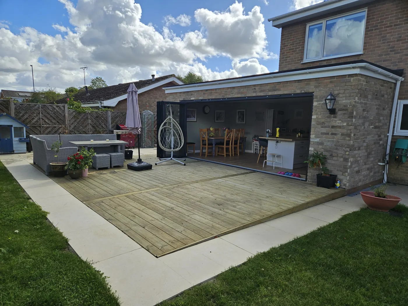 Finished rear extension with bifold doors and decking at Okebourne Park, Liden