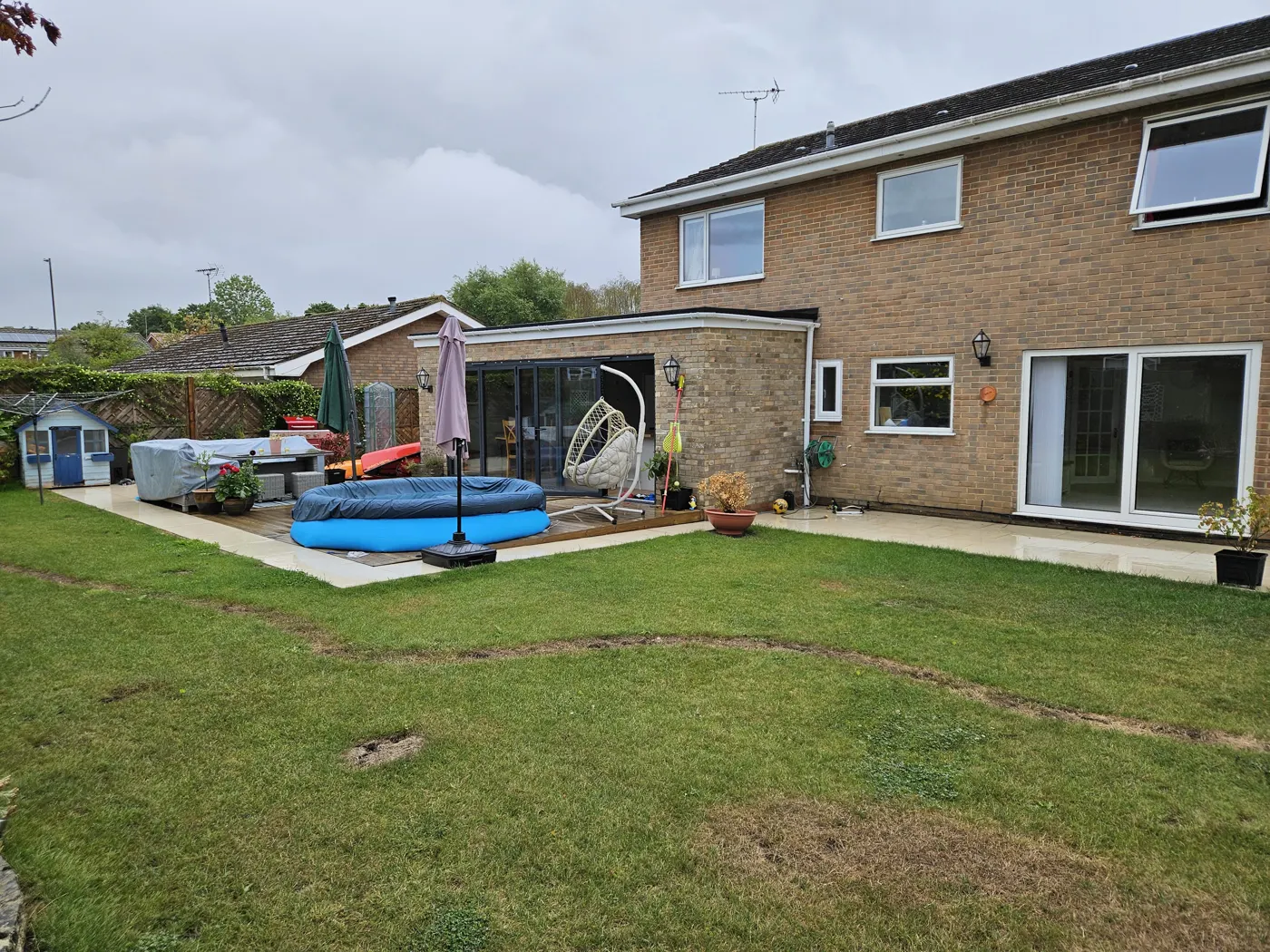 The rear of the house two years after completion with lawn and patio