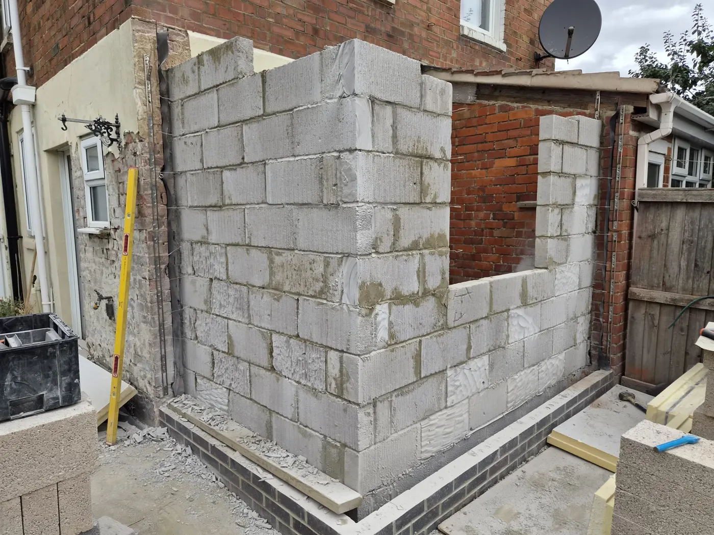 Cavity blockwork walls rising with a window opening formed