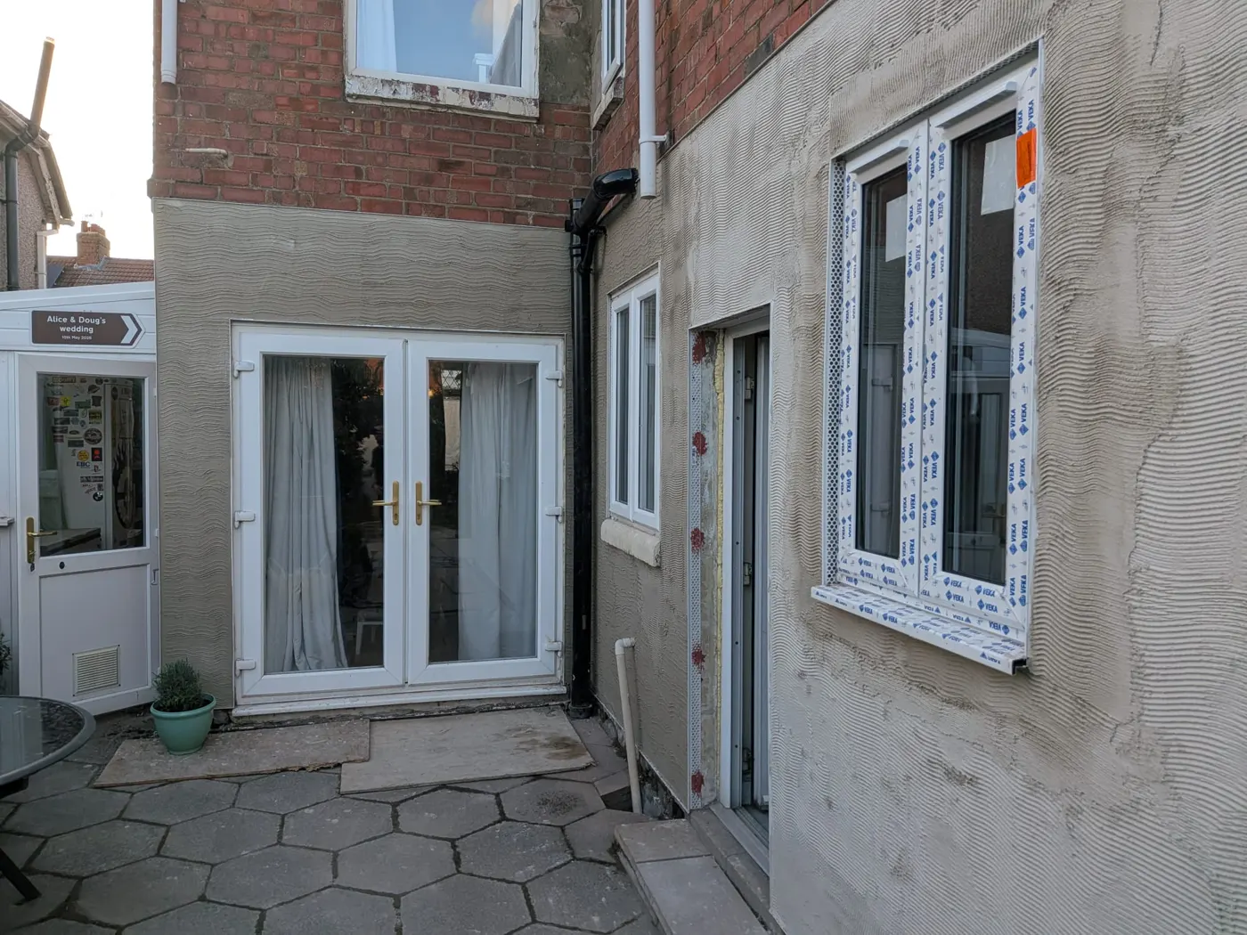 New French doors fitted in the rendered rear extension