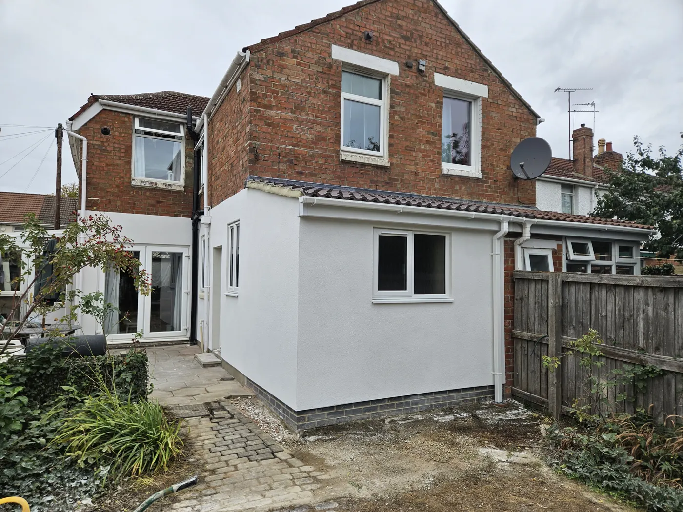 The finished rendered extension from the garden