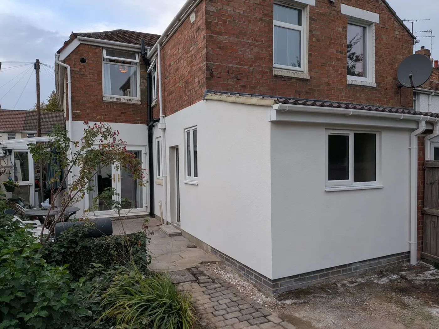 Finished rendered single-storey rear extension with French doors on Shrivenham Road, Broadgreen