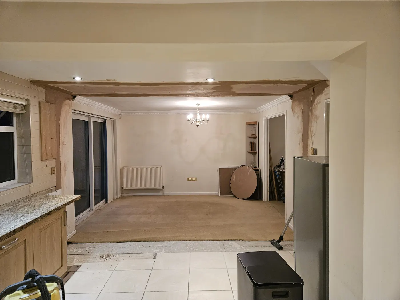 Open-plan kitchen and living room in Lawn, Swindon, after the dividing wall was removed and the steel boxed in