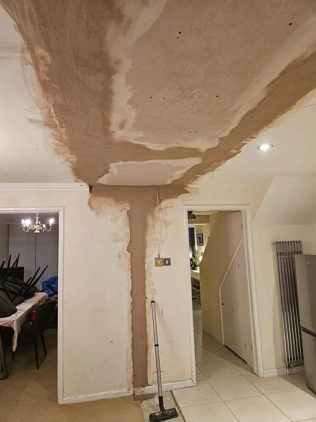 The boxed-in steel beam plastered into the ceiling
